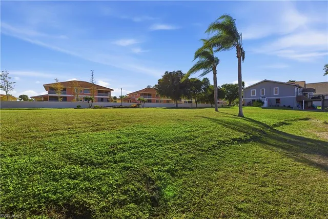 a view of a golf course with a lake