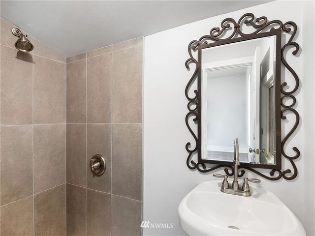 a bathroom with a sink and mirror