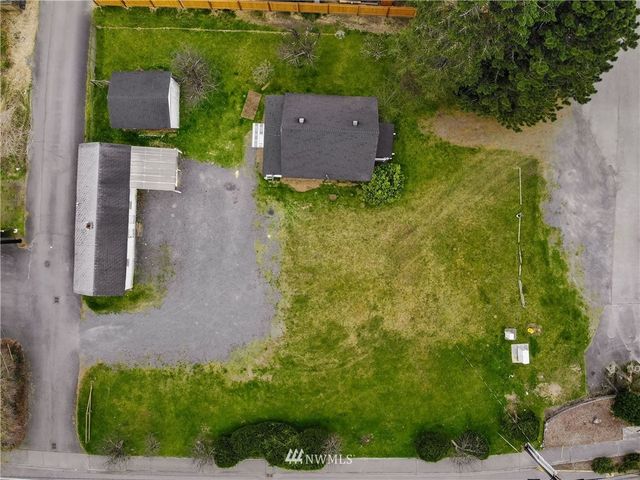 an aerial view of residential house with outdoor space