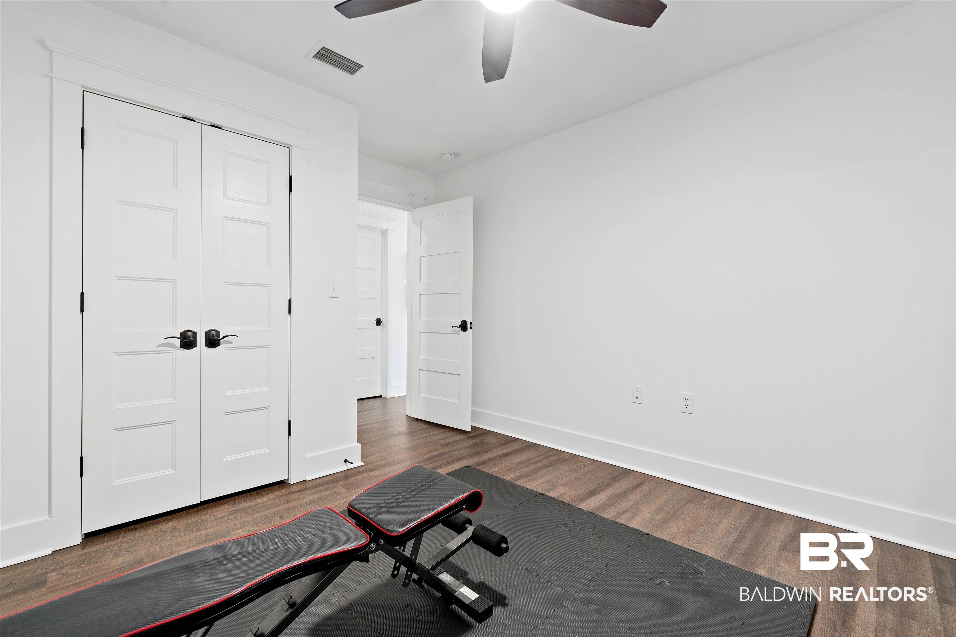 3808 Claridge Road North Mobile, AL 36608 - Photo 32 of 43 Exercise room with dark wood-type flooring and ceiling fan