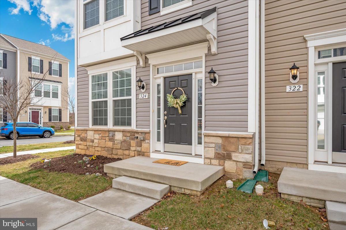 324 Spring Bank Way Frederick, MD 21701 - Photo 42 of 48 a front view of a house with a outdoor seating