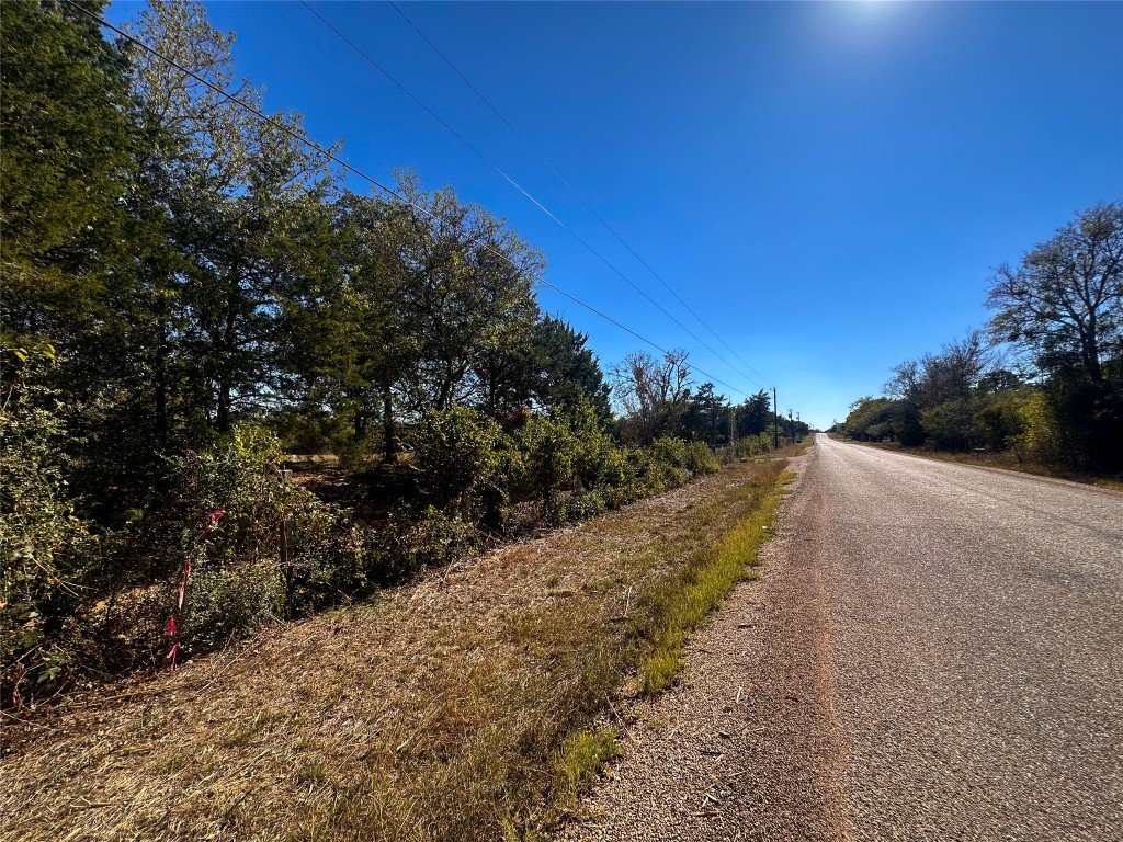 Lot 9 Foothill Road Bastrop, TX 78602 - Photo 3 of 12 a view of a road with a yard