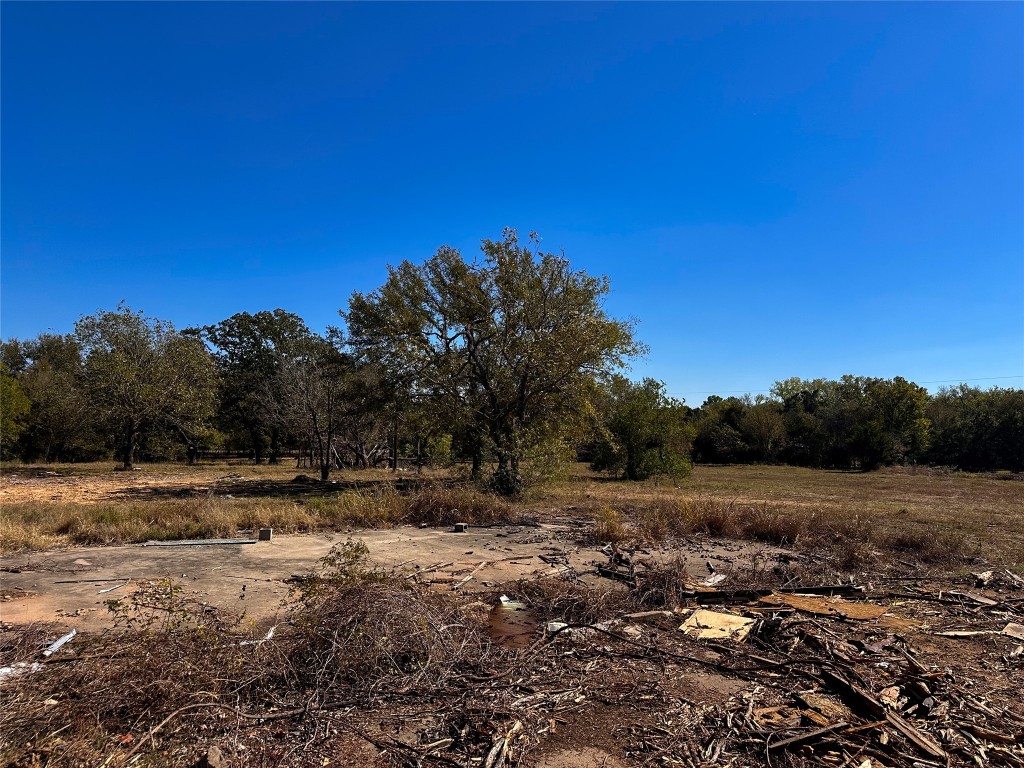 Lot 9 Foothill Road Bastrop, TX 78602 - Photo 4 of 12 a view of dirt field with trees