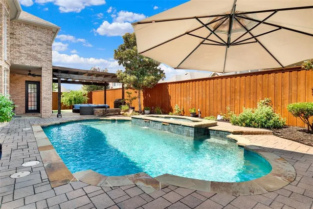 a view of swimming pool with outdoor seating