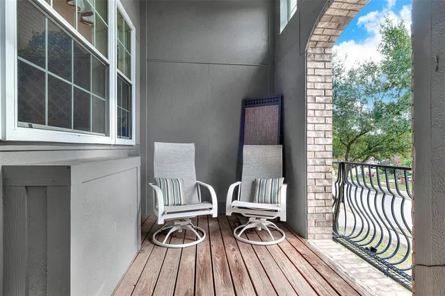 a living room with furniture and white walls