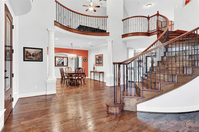 a view of dining room with furniture wooden floor and a chandelier