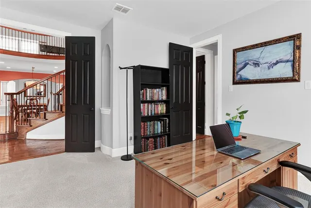 a view of a workspace with furniture