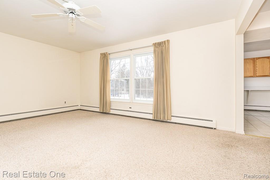 28777 West 11 Mile Road Farmington, MI 48336 - Photo 10 of 53 Another view of the spacious living room, leading to the kitchen