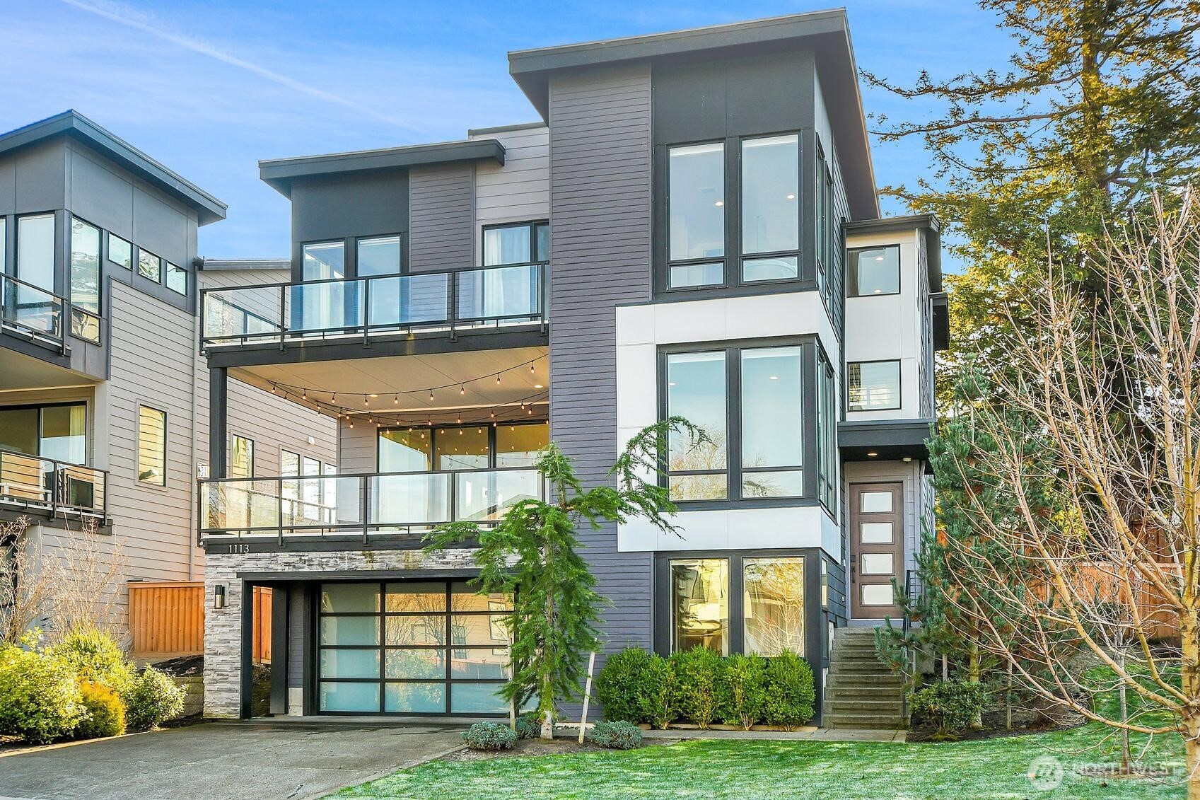 a front view of a residential apartment building with a yard