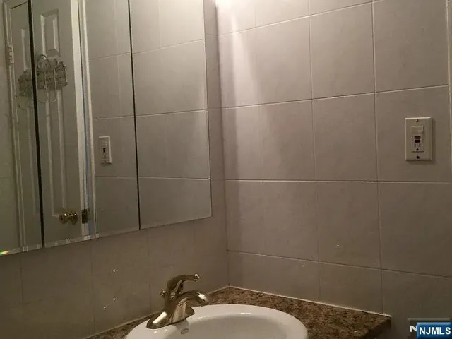 a bathroom with a sink and shower