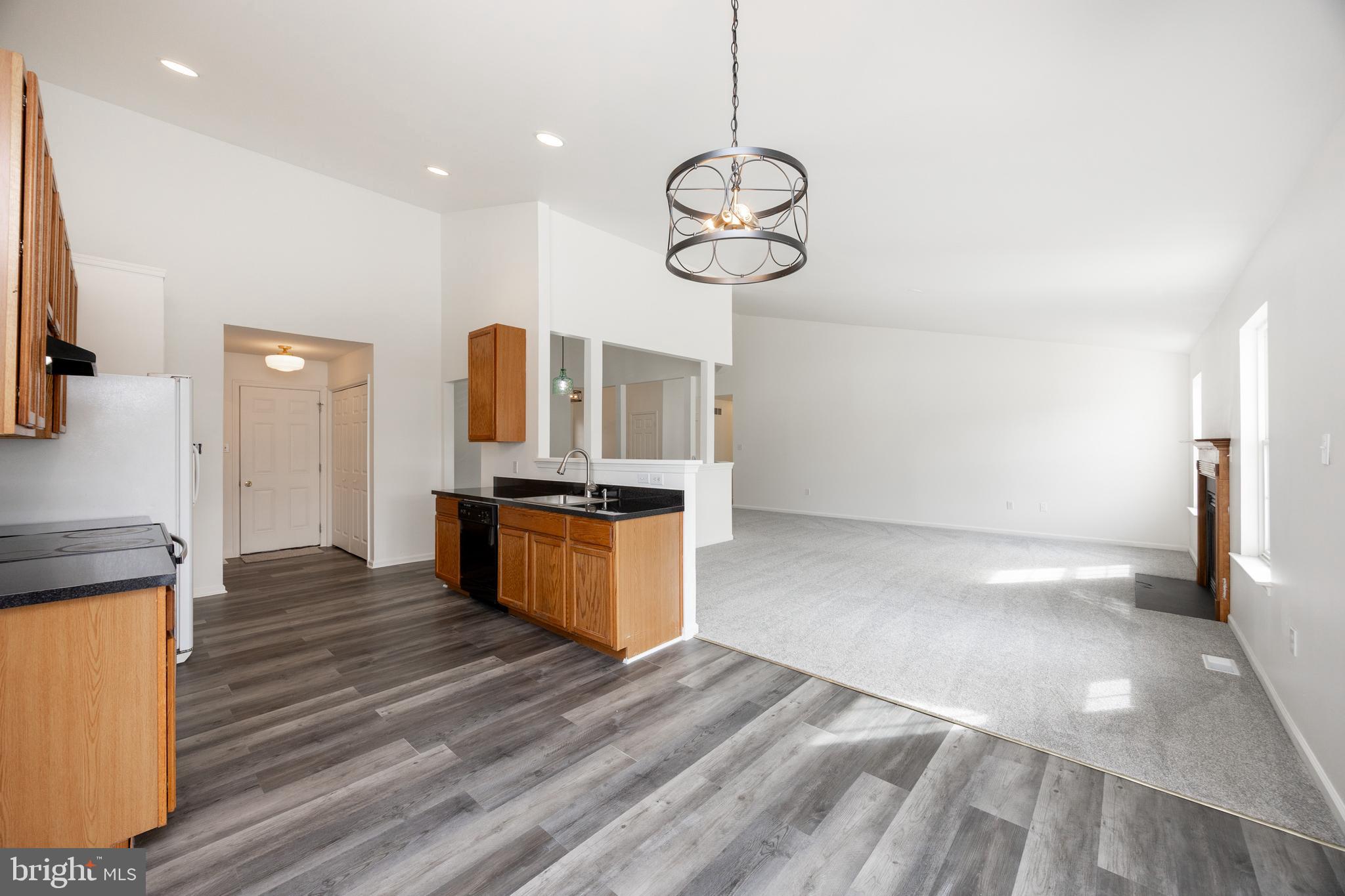 97 Needham Drive Smyrna, DE 19977 - Photo 13 of 52 a view of a kitchen with a sink and wooden floor
