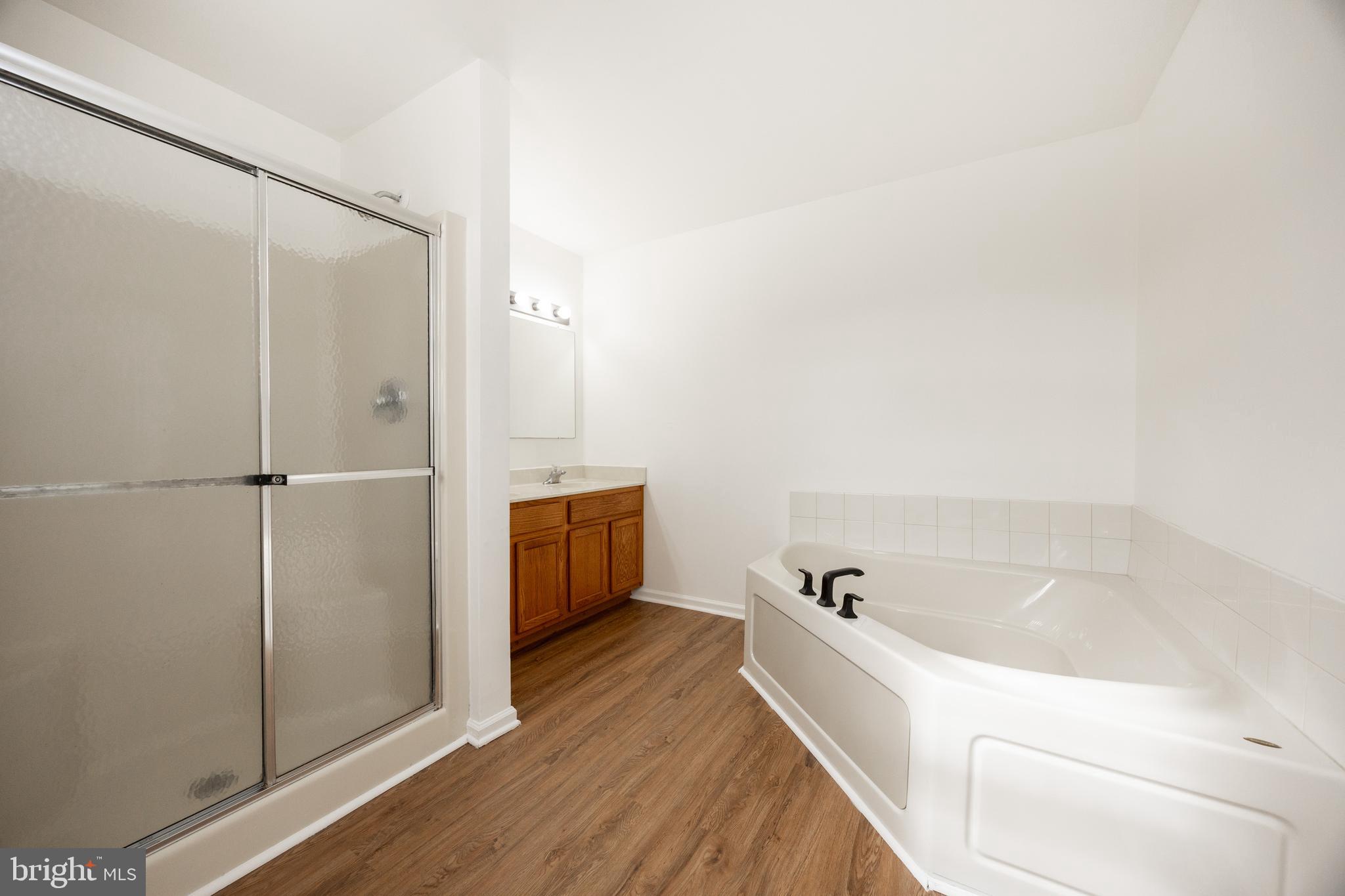 97 Needham Drive Smyrna, DE 19977 - Photo 28 of 52 a bathroom with a bathtub and shower