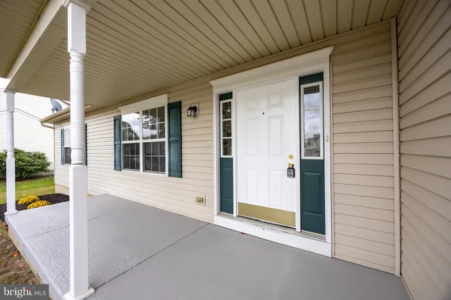 a aerial view of a house with a yard