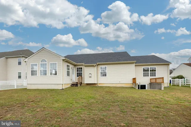 a view of a house with a bench