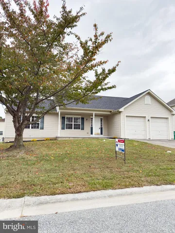 an aerial view of residential houses with outdoor space and swimming pool