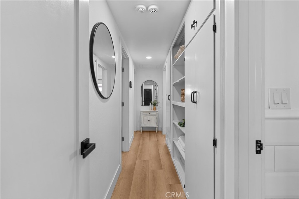 225 South Feldner Road Orange, CA 92868 - Photo 11 of 40 a view of a hallway with wooden floor and staircase