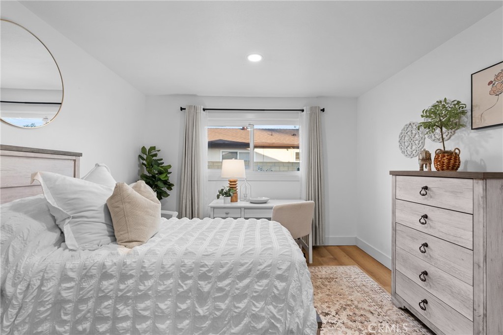 225 South Feldner Road Orange, CA 92868 - Photo 16 of 40 a bedroom with a bed and window