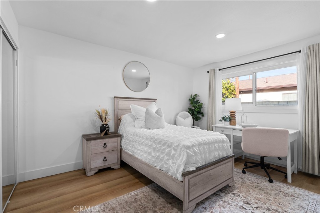 225 South Feldner Road Orange, CA 92868 - Photo 17 of 40 a bedroom with a bed chair and a window