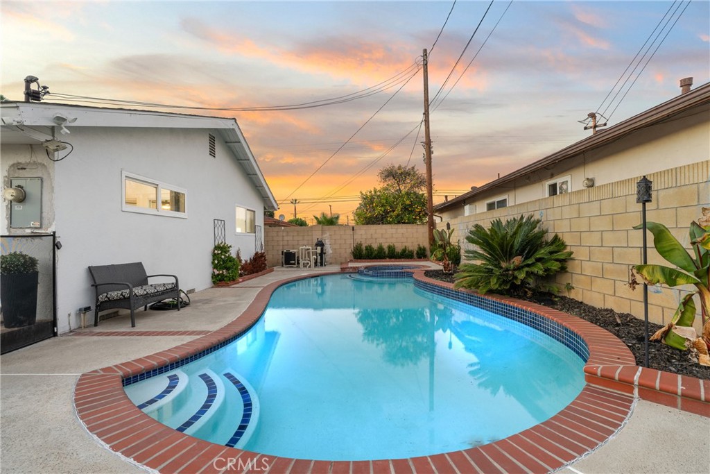 225 South Feldner Road Orange, CA 92868 - Photo 21 of 40 a view of a swimming pool with a lounge chair