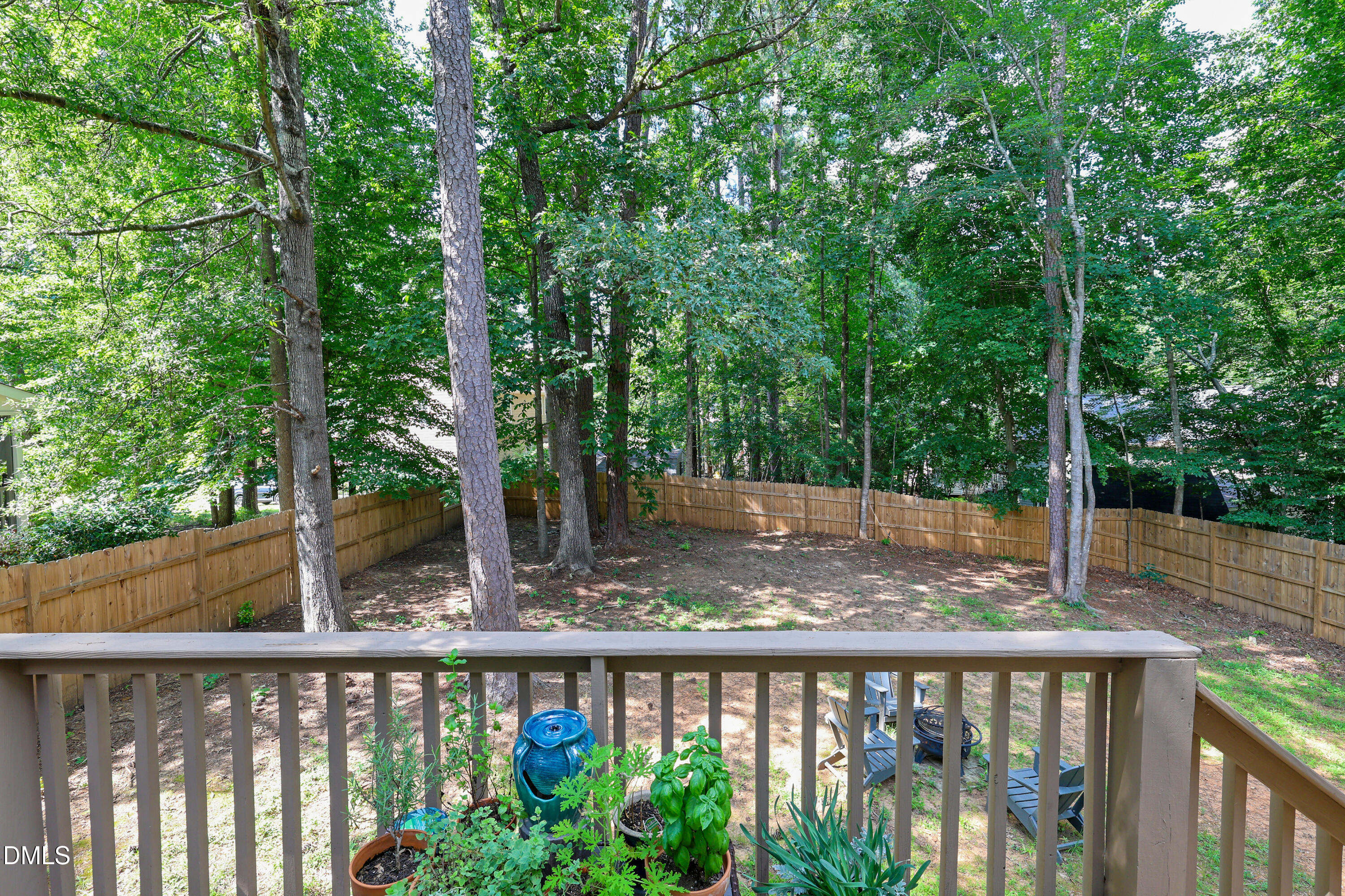3011 Elk Ridge Road Durham, NC 27712 - Photo 3 of 68 a view of a wooden deck and trees
