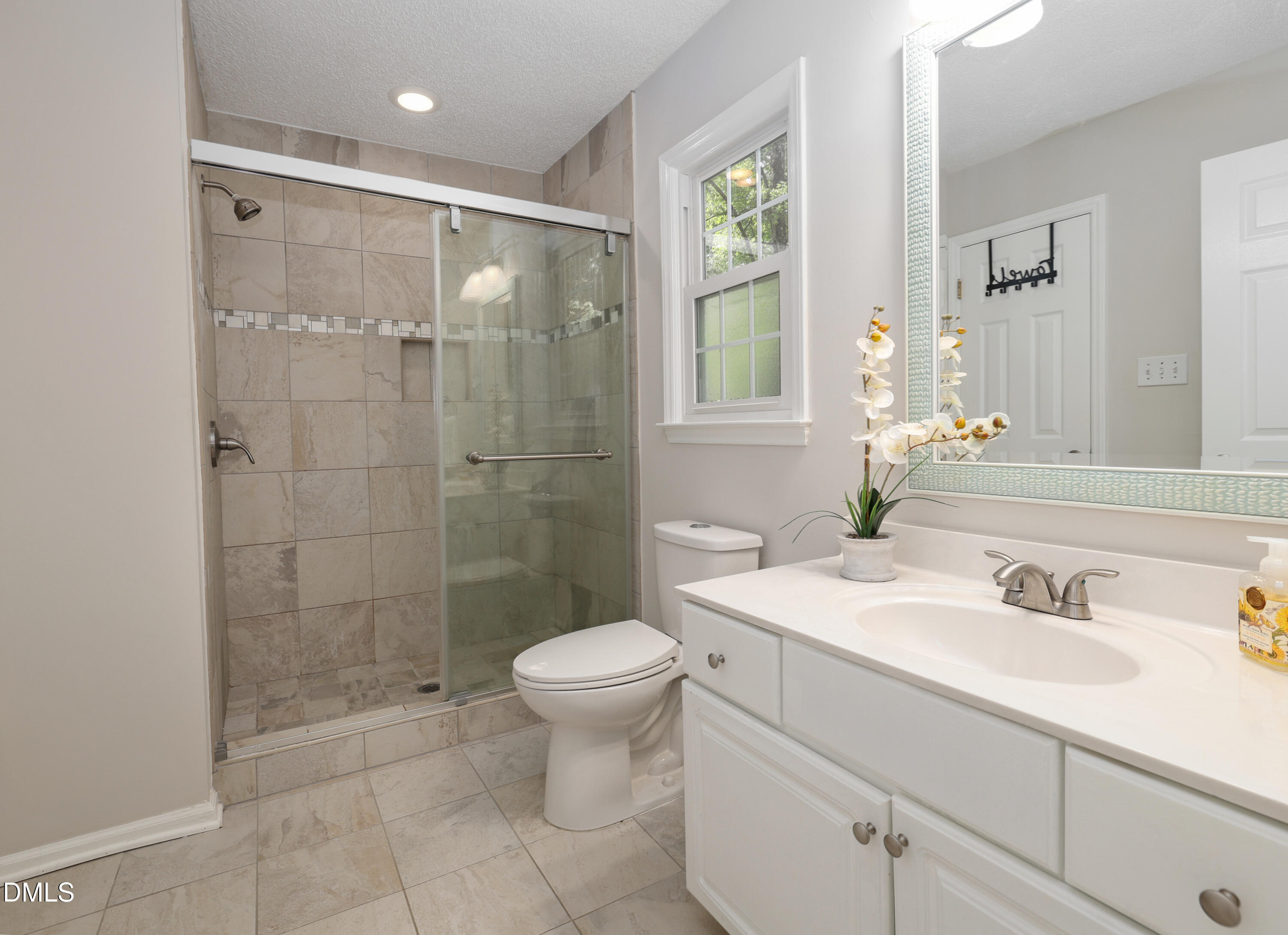 3011 Elk Ridge Road Durham, NC 27712 - Photo 33 of 68 a bathroom with a sink toilet and shower