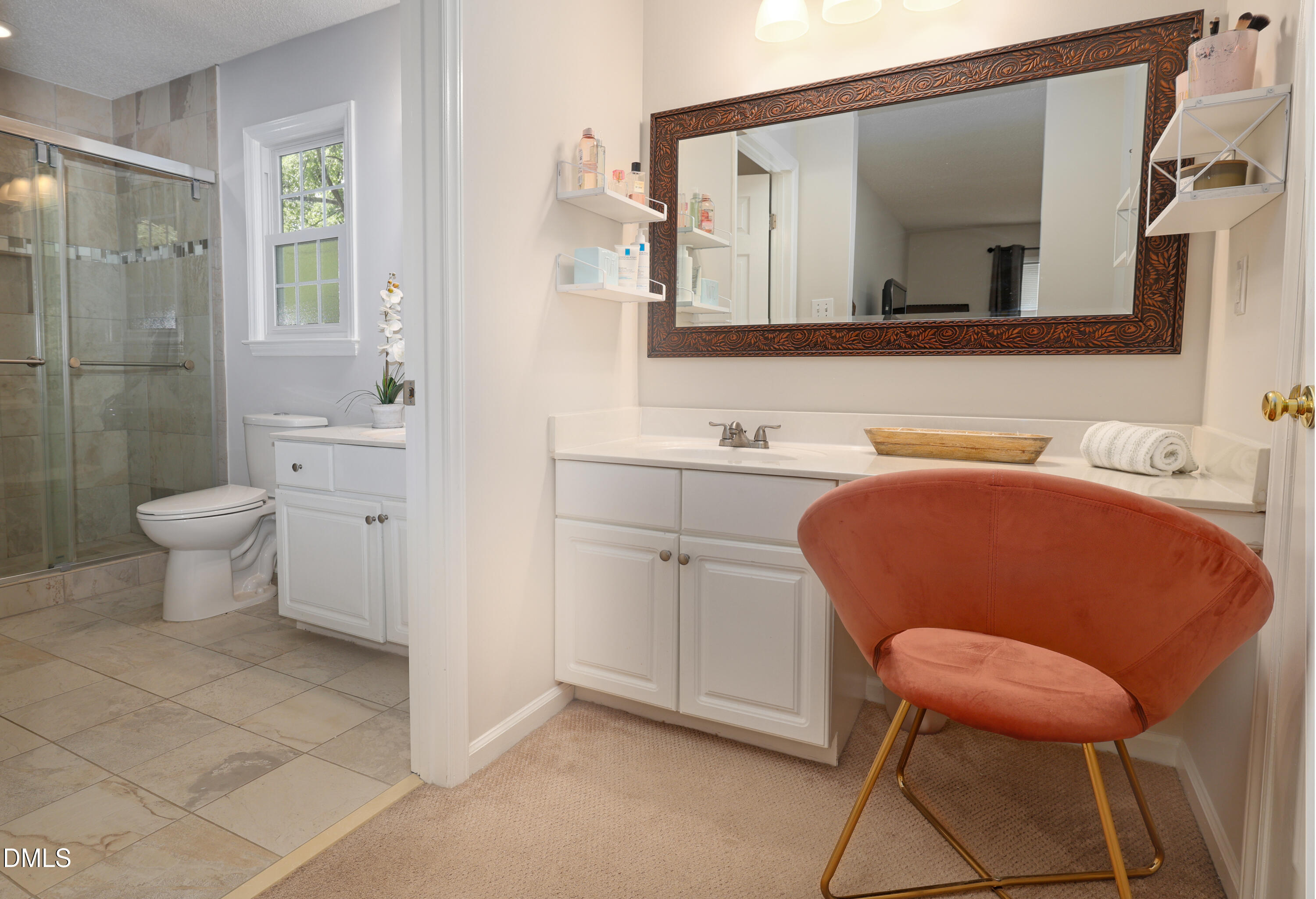 3011 Elk Ridge Road Durham, NC 27712 - Photo 35 of 68 a bathroom with a toilet sink and mirror