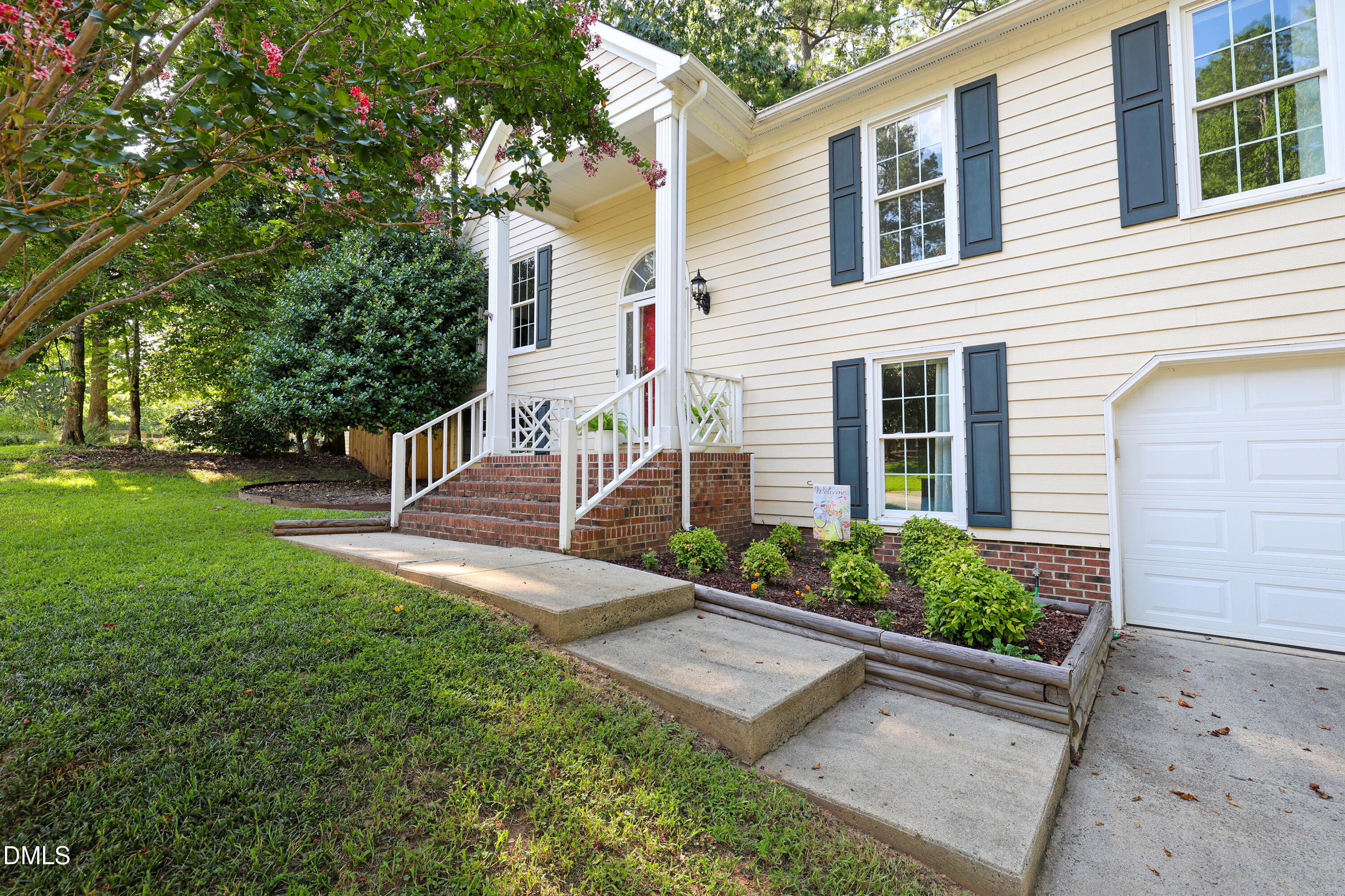 3011 Elk Ridge Road Durham, NC 27712 - Photo 58 of 68 a view of a house with backyard and a garden