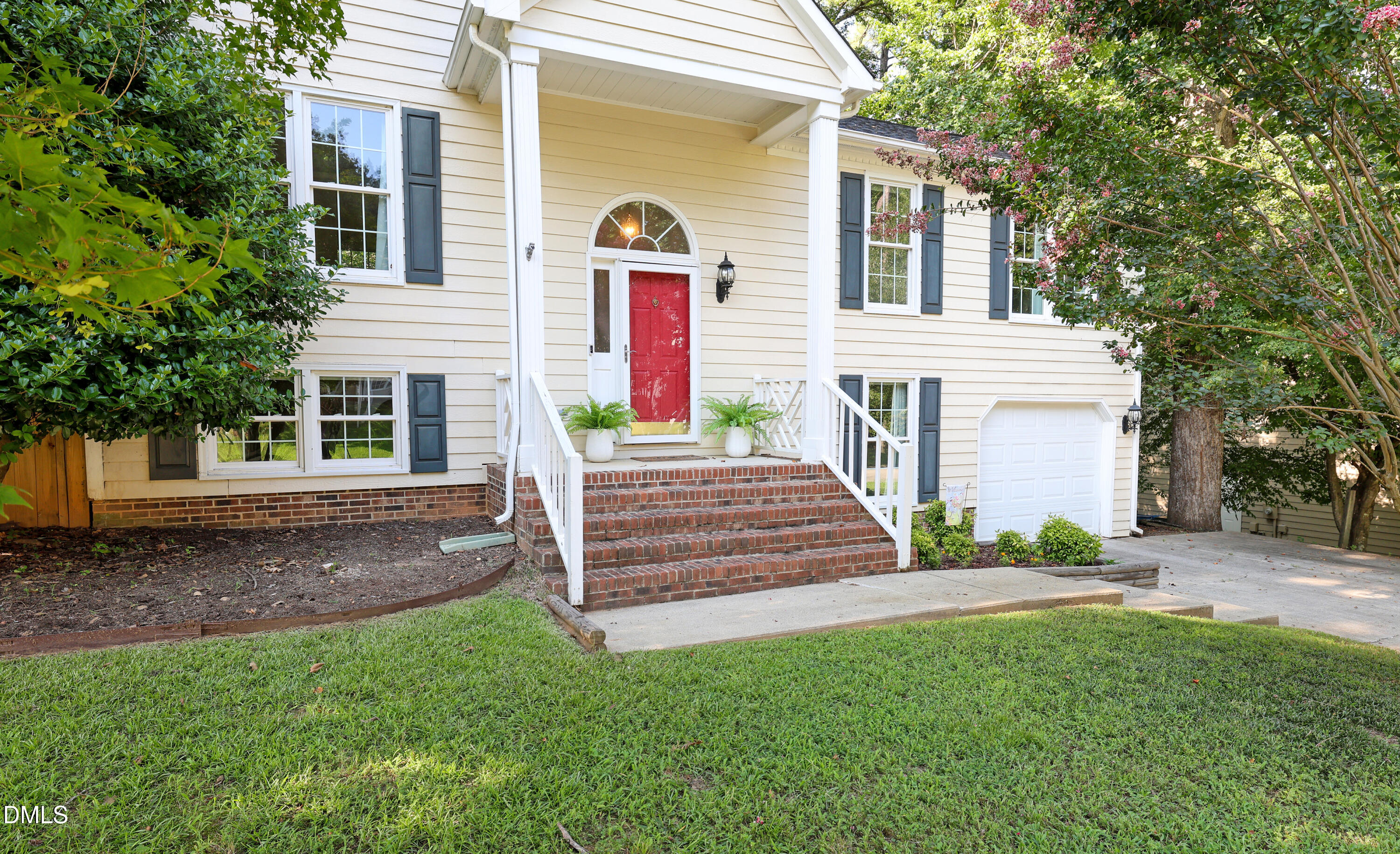 3011 Elk Ridge Road Durham, NC 27712 - Photo 64 of 68 a front view of a house with a yard