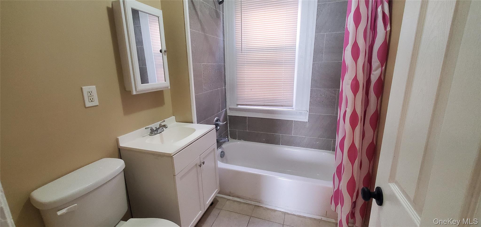 197 Winnikee Avenue, Unit 2 Poughkeepsie, NY 12601 - Photo 17 of 22 a bathroom with a sink toilet vanity and bathtub
