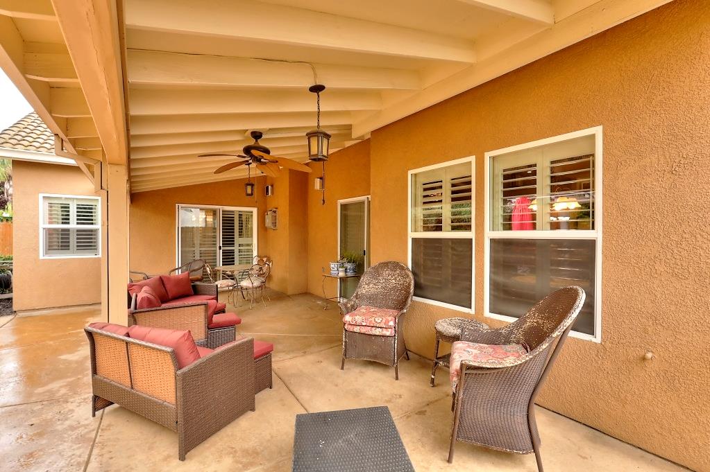 4152 Post Oak Drive Turlock, CA 95382 - Photo 66 of 71 a outdoor space with patio the couches and a dining table with the view of the small garden