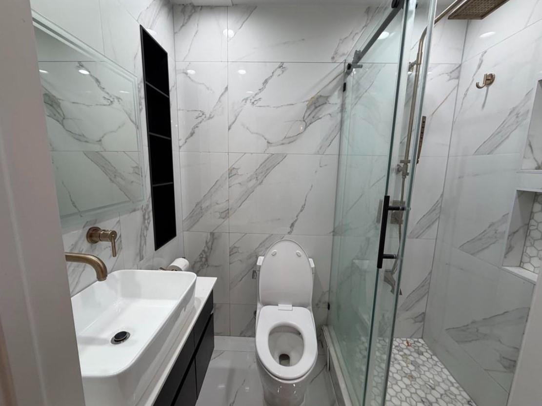 202 48th Street, Unit 3 Union City, NJ 07087 - Photo 5 of 10 a bathroom with a sink and toilet