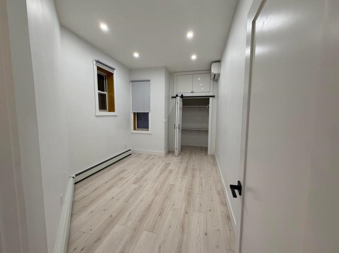 202 48th Street, Unit 3 Union City, NJ 07087 - Photo 6 of 10 a view of empty room with wooden floor
