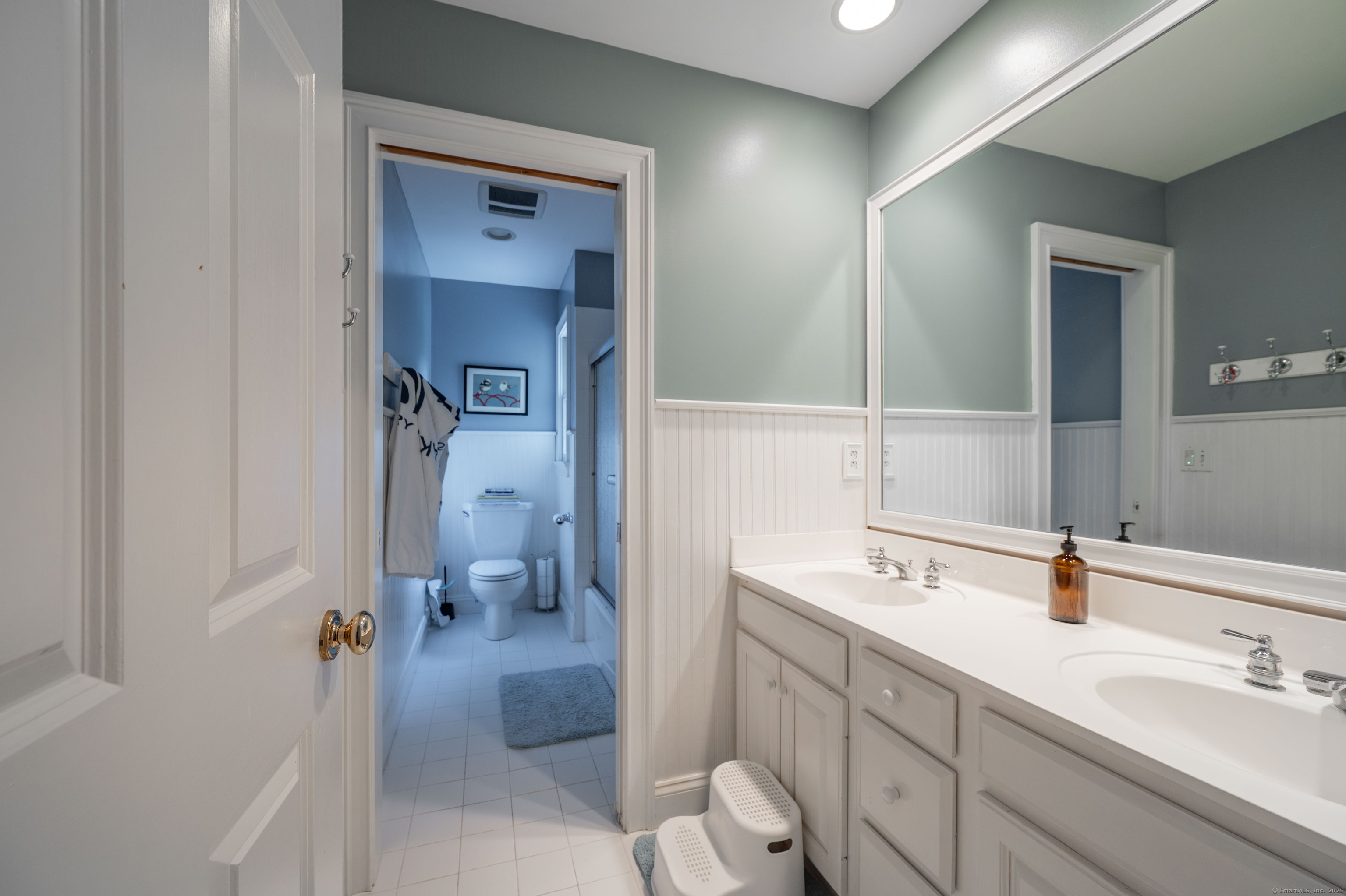 64 River Ford Road Brookfield, CT 06804 - Photo 16 of 28 a bathroom with a sink a toilet and shower