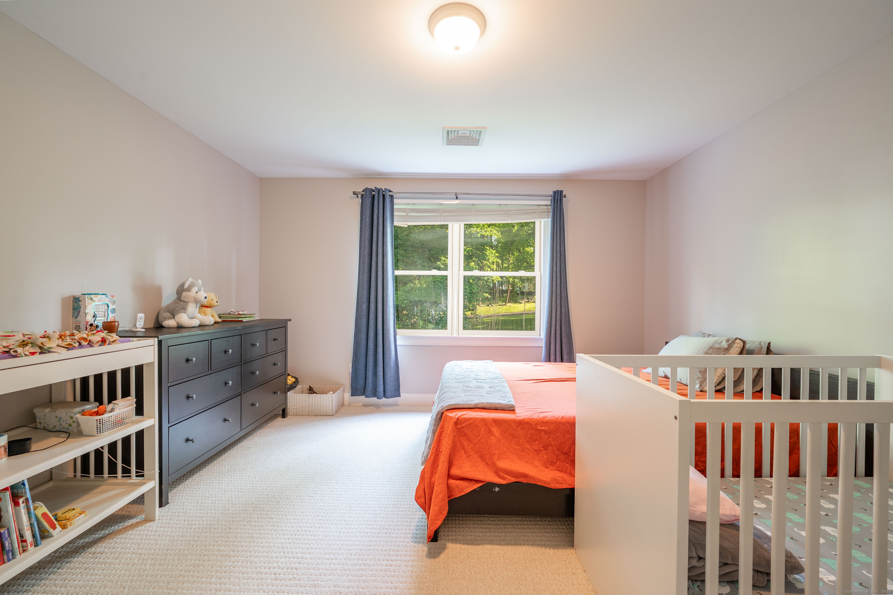 64 River Ford Road Brookfield, CT 06804 - Photo 18 of 28 a bedroom with furniture and a window