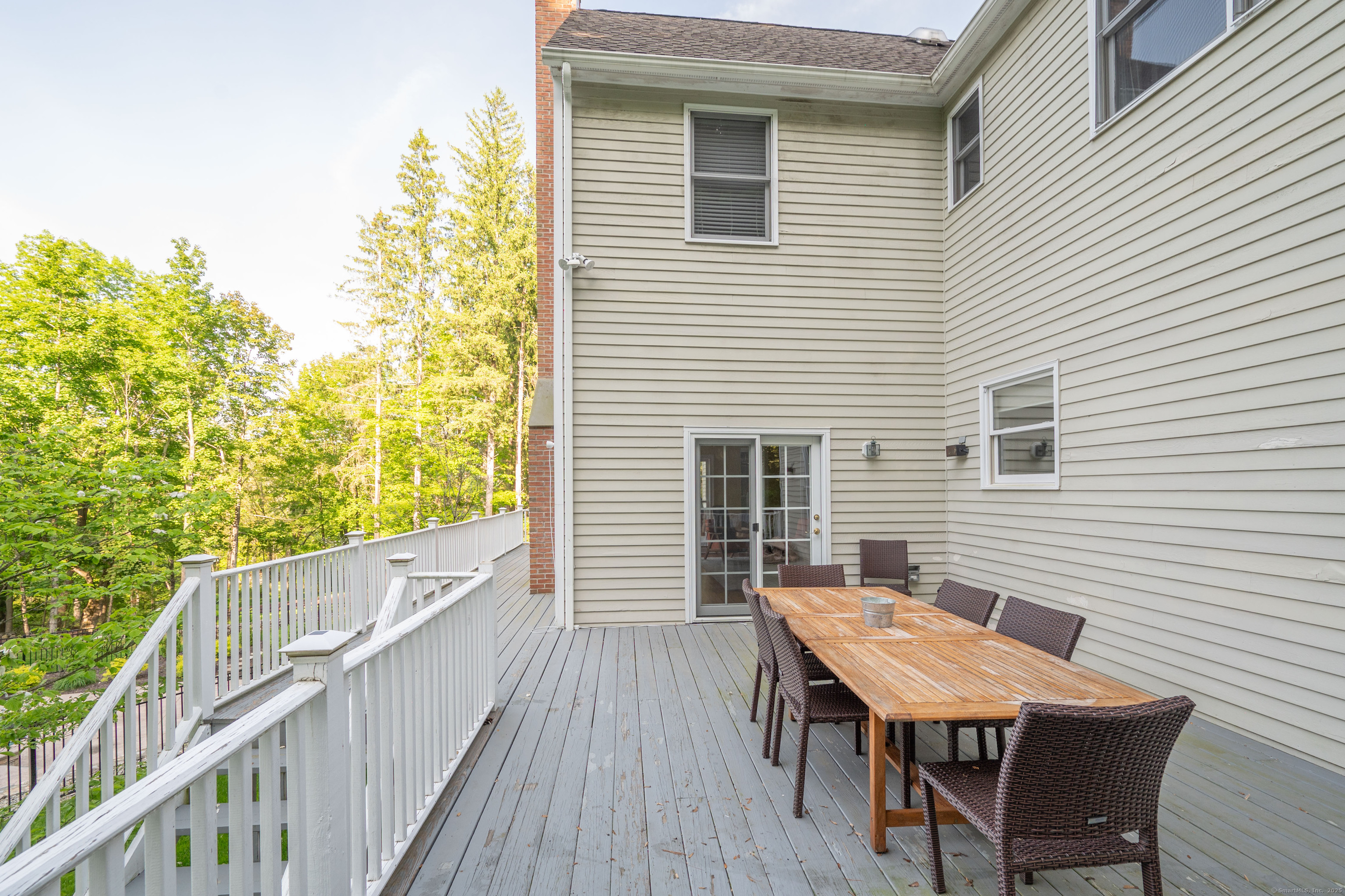64 River Ford Road Brookfield, CT 06804 - Photo 23 of 28 a balcony with table and chairs
