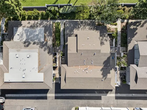 an aerial view of waterside residential houses with outdoor space
