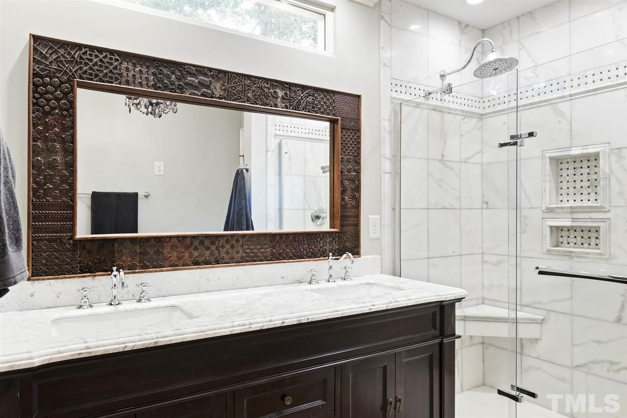 3712 Bellevue Road Raleigh, NC 27609 - Photo 19 of 30 Private water closet, double vanity with marble tile, tile flooring, over sized shower with rain shower head, linen closet and walk in closet.