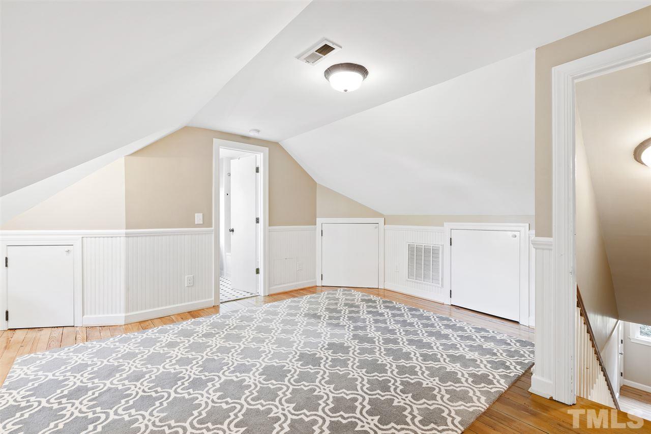 3712 Bellevue Road Raleigh, NC 27609 - Photo 22 of 30 This space can be a number of things! Teen suite, media room, HOME office or guest bedroom. Pine flooring, bead board knee walls with lots of storage, remote LED lighting, built-in queen bed with twin trundle. Bonus cedar closet!