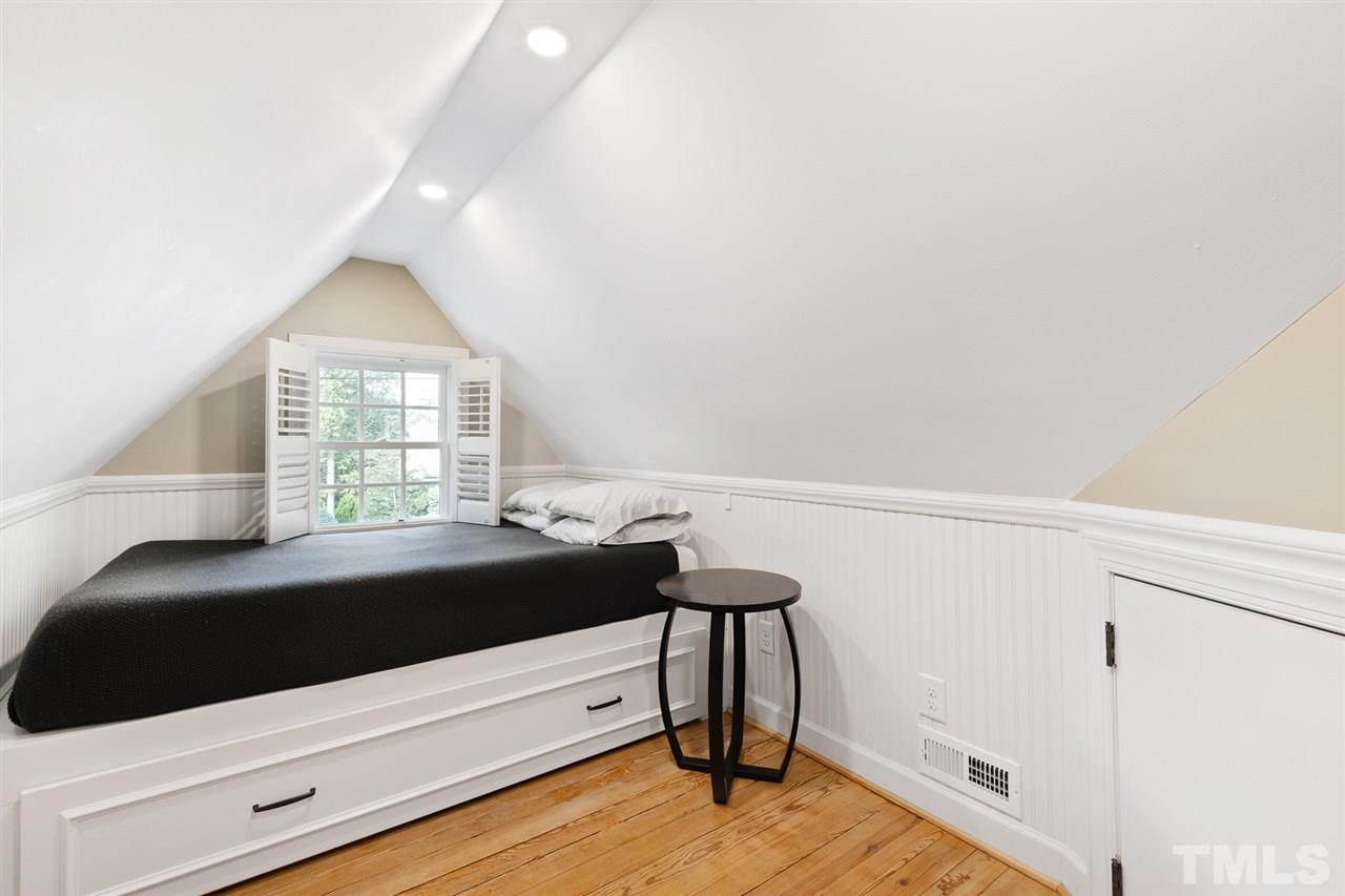 3712 Bellevue Road Raleigh, NC 27609 - Photo 23 of 30 This space can be a number of things! Teen suite, media room, HOME office or guest bedroom. Pine flooring, bead board knee walls with lots of storage, remote LED lighting, built-in queen bed with twin trundle. Bonus cedar closet!