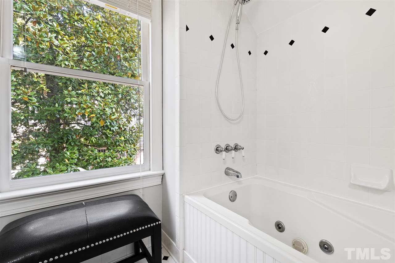 3712 Bellevue Road Raleigh, NC 27609 - Photo 25 of 30 2nd Bath with jetted tub, solid surface vanity top, medicine cabinet and elongated toilet.