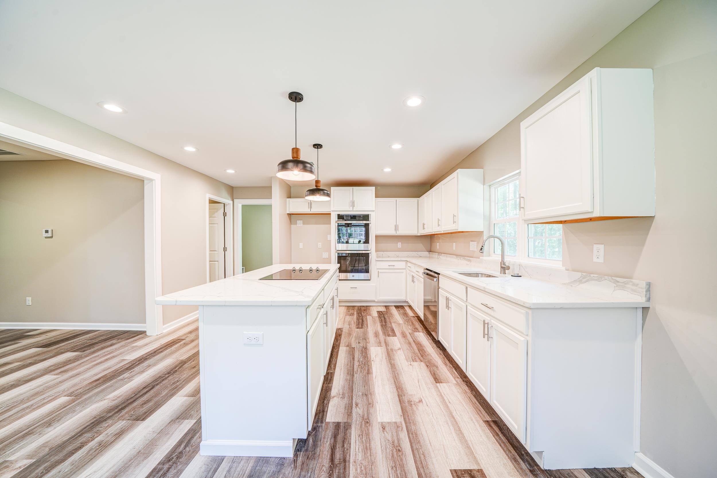 4630 Billy Maher Road Bartlett, TN 38135 - Photo 13 of 40 a view of a kitchen with kitchen island a sink a counter top space and stainless steel appliances