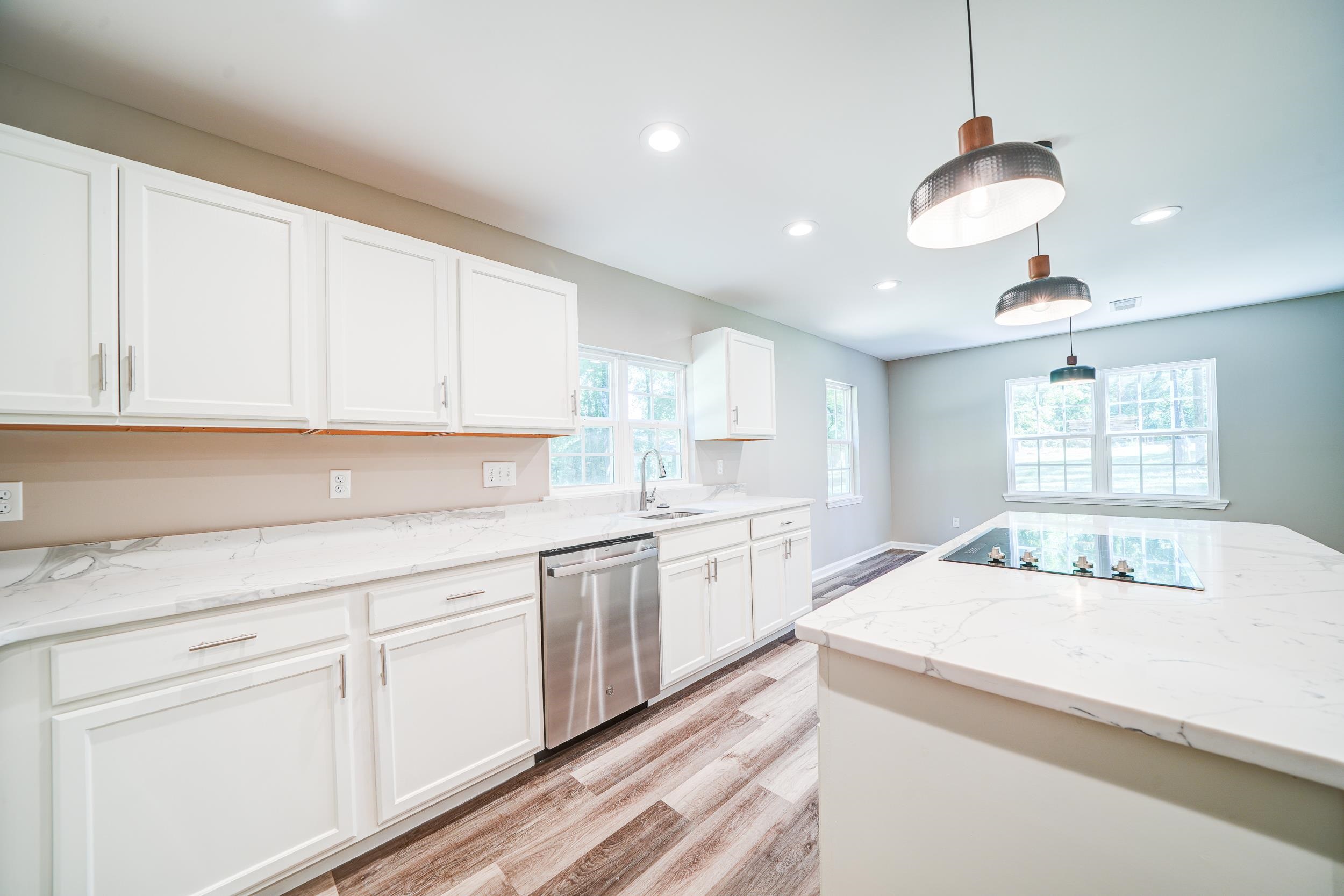 4630 Billy Maher Road Bartlett, TN 38135 - Photo 14 of 40 a kitchen with granite countertop white cabinets white appliances a sink and a window