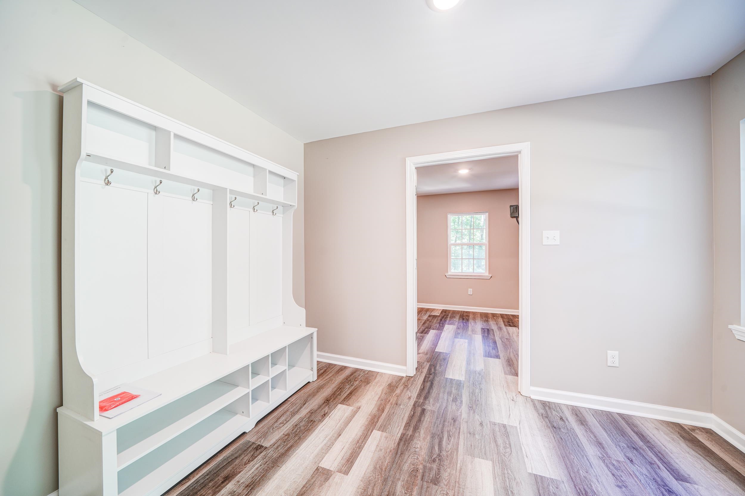 4630 Billy Maher Road Bartlett, TN 38135 - Photo 17 of 40 a view of an empty room and wooden floor