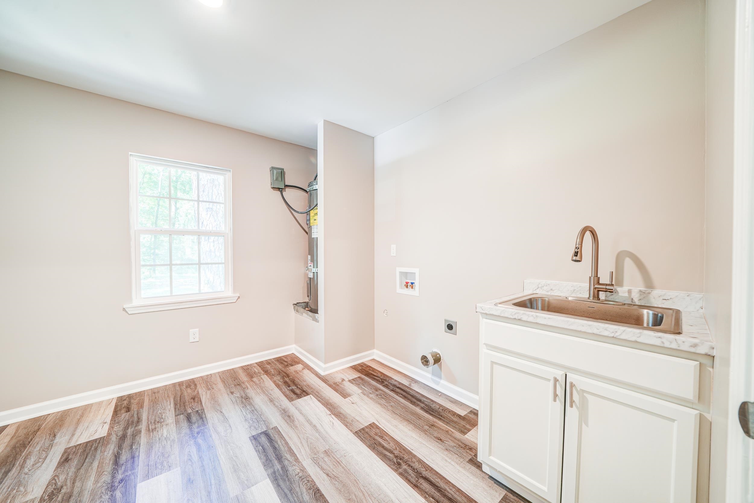 4630 Billy Maher Road Bartlett, TN 38135 - Photo 18 of 40 a bedroom with a sink and a window