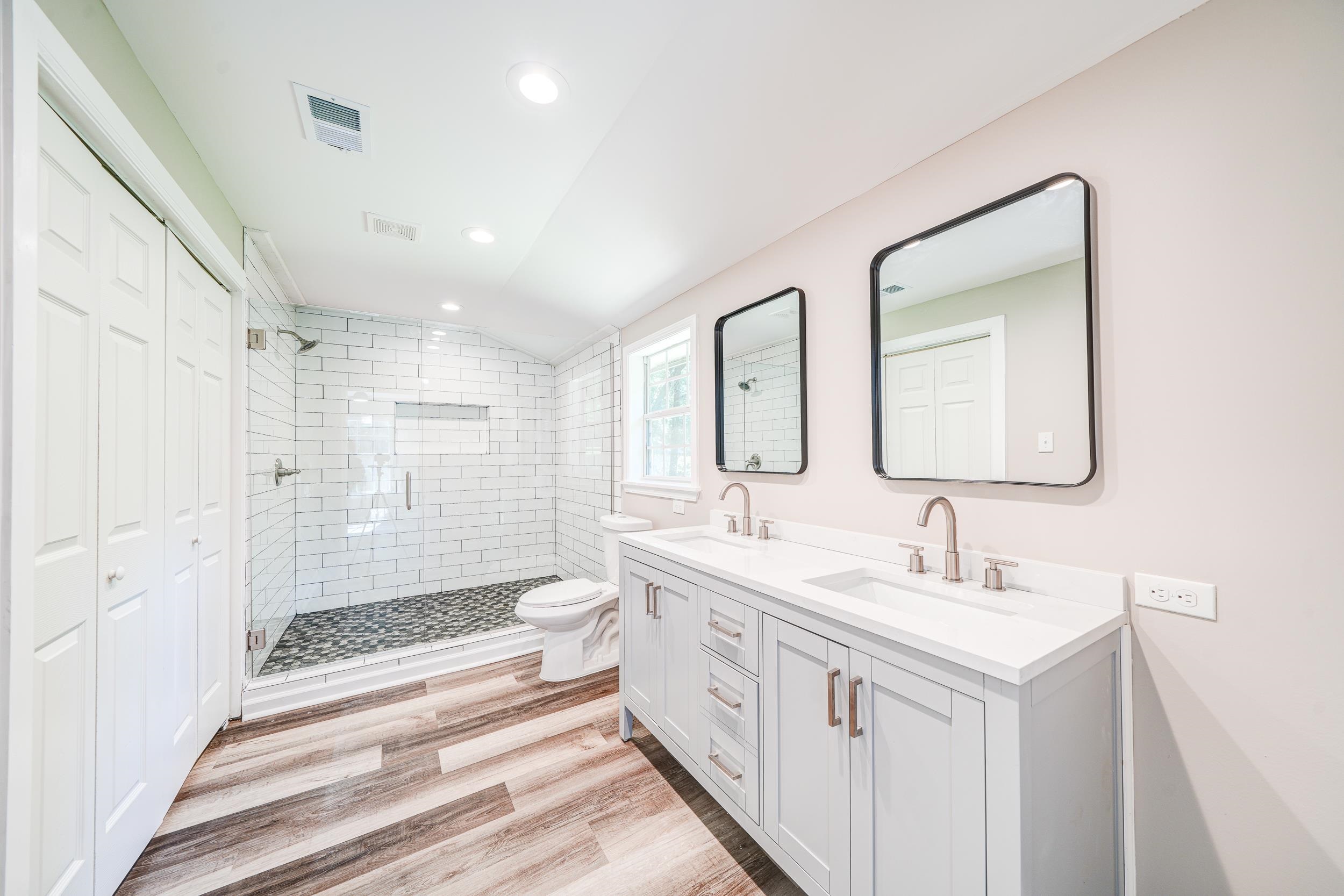 4630 Billy Maher Road Bartlett, TN 38135 - Photo 26 of 40 a bathroom with a double vanity sink mirror and shower