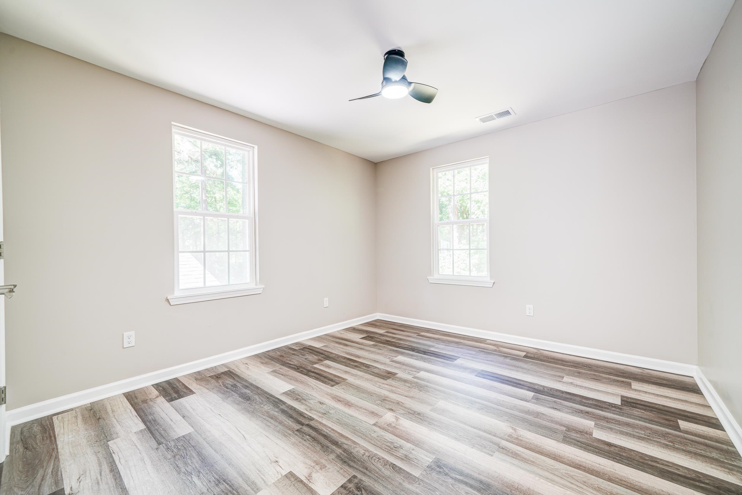 4630 Billy Maher Road Bartlett, TN 38135 - Photo 28 of 40 a view of empty room with wooden floor and fan