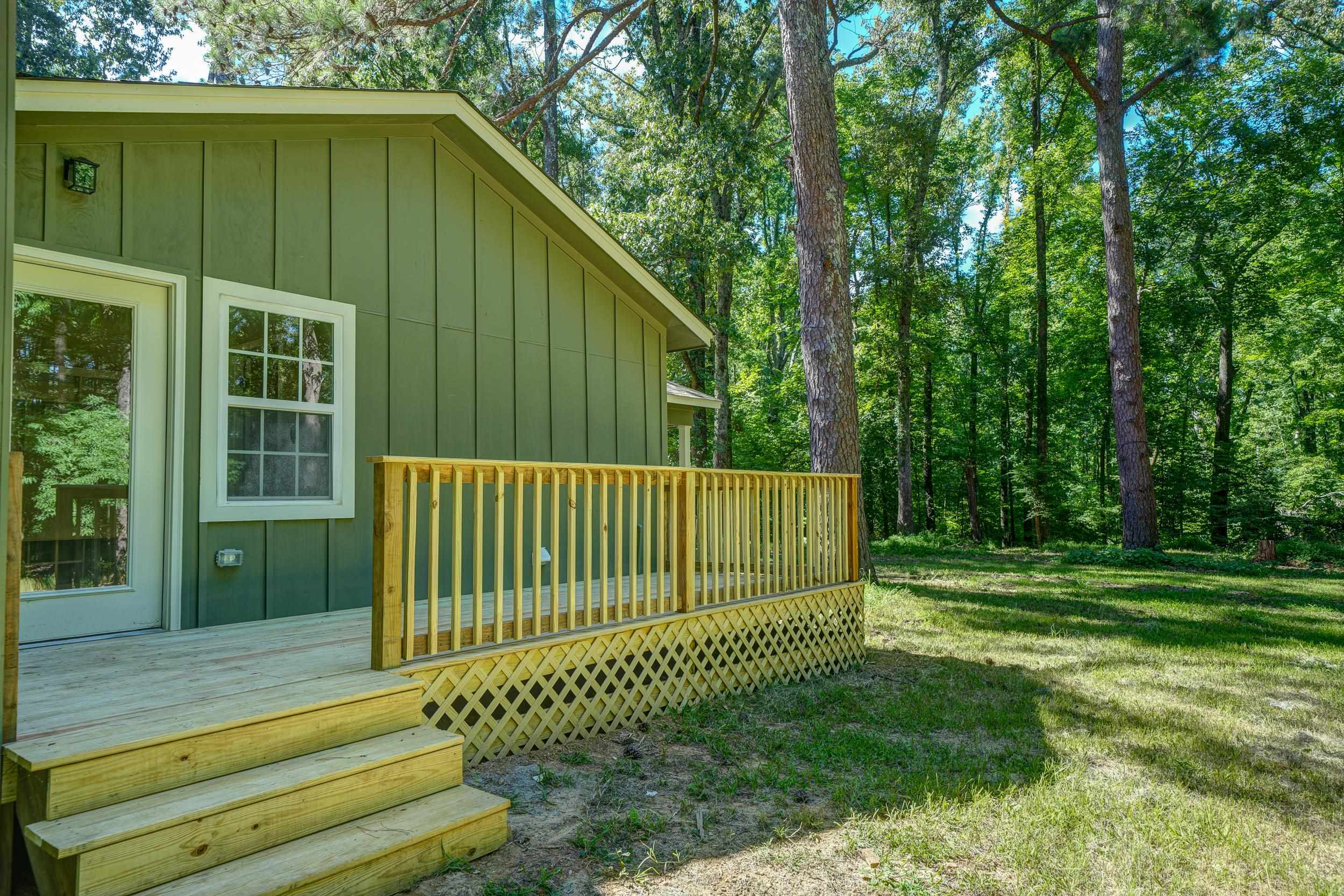 4630 Billy Maher Road Bartlett, TN 38135 - Photo 37 of 40 a view of a house with a small yard plants and large trees