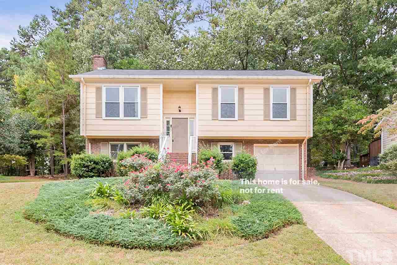 7809 Foxwood Drive Raleigh, NC 27615 - Photo 1 of 17 front view of a house with a yard