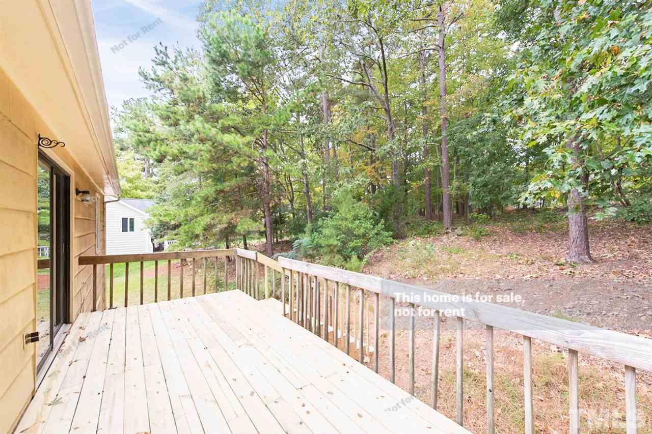 7809 Foxwood Drive Raleigh, NC 27615 - Photo 16 of 17 a view of a wooden fence