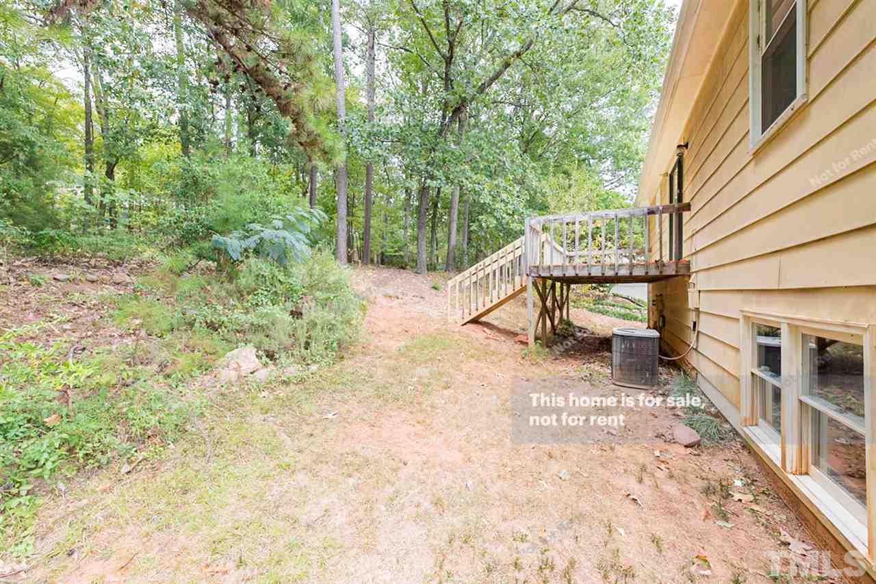 7809 Foxwood Drive Raleigh, NC 27615 - Photo 17 of 17 a view of a house with backyard and sitting area